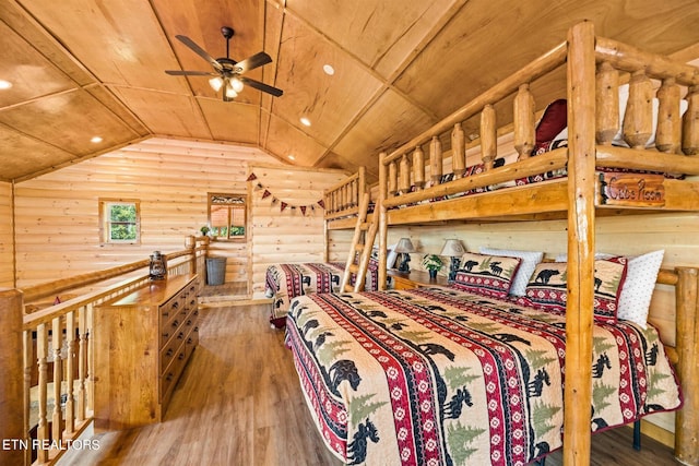 bedroom featuring wooden ceiling, hardwood / wood-style flooring, and vaulted ceiling