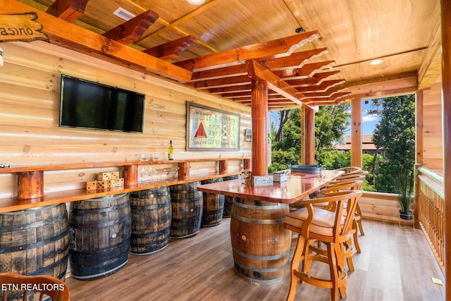 interior space featuring an outdoor bar and ceiling fan