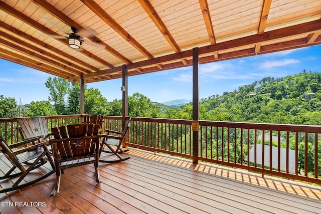 wooden deck with ceiling fan