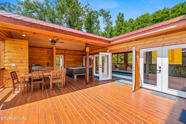 wooden terrace with french doors, an outdoor living space, and grilling area