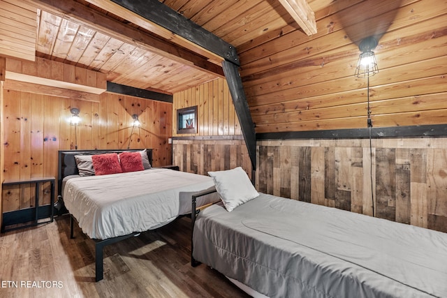 bedroom with wood-type flooring, wooden walls, beamed ceiling, and wooden ceiling