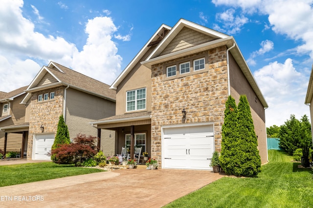 craftsman-style house featuring a front lawn, a porch, and a garage