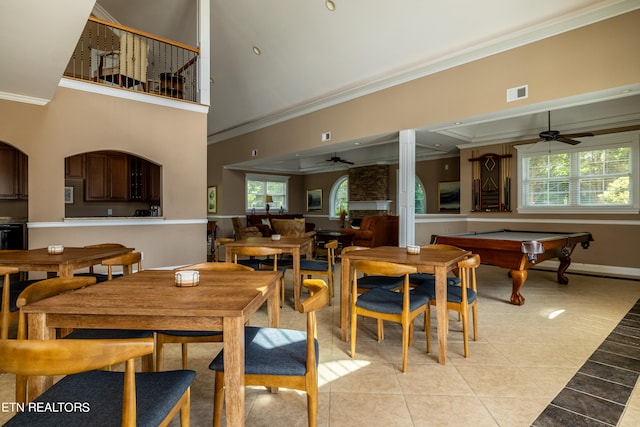 tiled dining space featuring ceiling fan, crown molding, and pool table