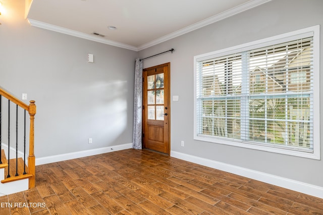 entryway featuring ornamental molding and wood-type flooring