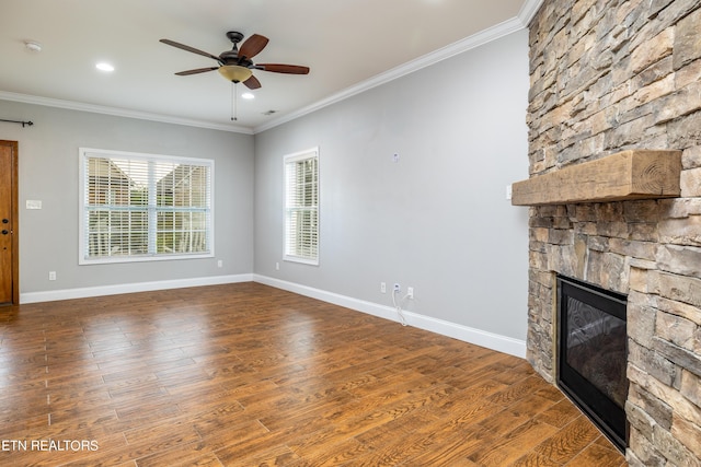 unfurnished living room with ceiling fan, crown molding, and a fireplace