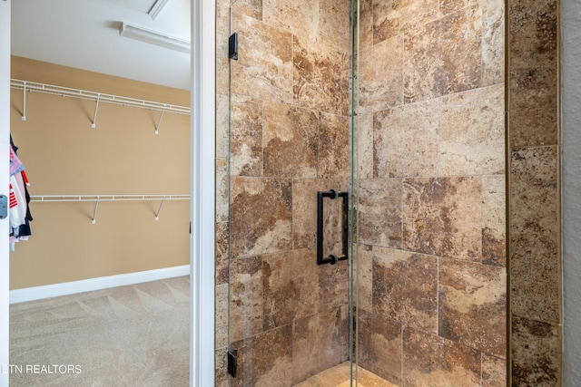 bathroom with a shower with shower door