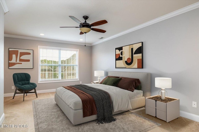 carpeted bedroom with ceiling fan and crown molding