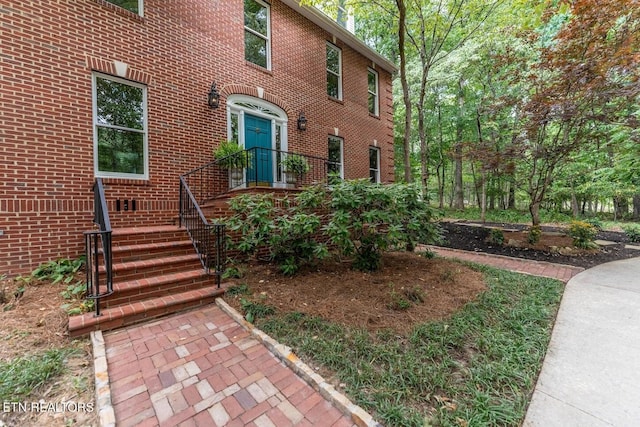 exterior space featuring brick siding
