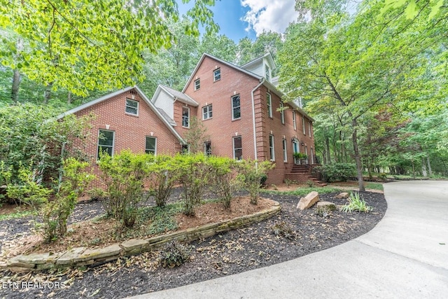 view of front of house featuring brick siding