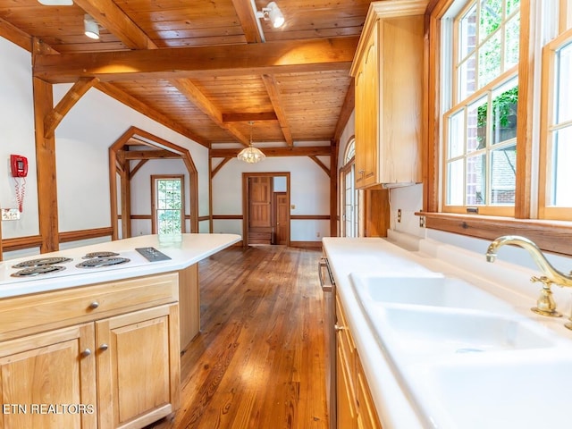 kitchen featuring decorative light fixtures, hardwood / wood-style floors, beam ceiling, wood ceiling, and light brown cabinets