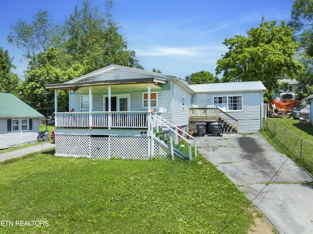 bungalow with a front lawn and a porch