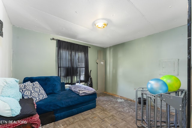 living room featuring electric panel and parquet floors