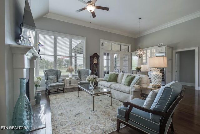 living room featuring ceiling fan, hardwood / wood-style floors, and crown molding