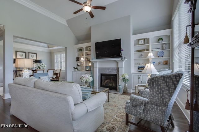 living room featuring ceiling fan, dark hardwood / wood-style flooring, and ornamental molding