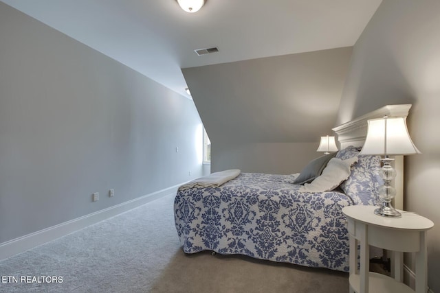 bedroom with carpet and lofted ceiling