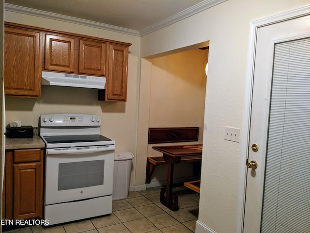 kitchen featuring light tile patterned flooring, crown molding, and electric stove