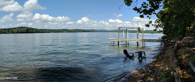 view of dock with a water view