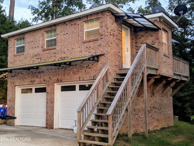 back of property featuring a garage