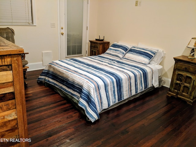 bedroom featuring dark wood-type flooring