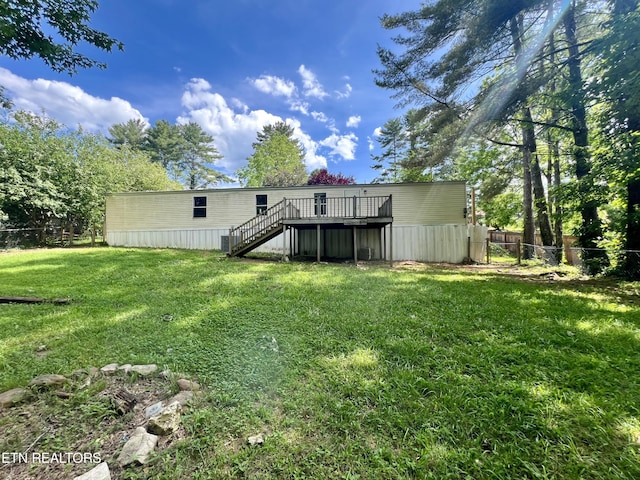 view of yard featuring a wooden deck