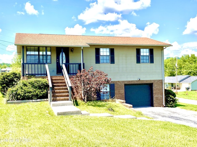 view of front of house with covered porch, a front yard, and a garage