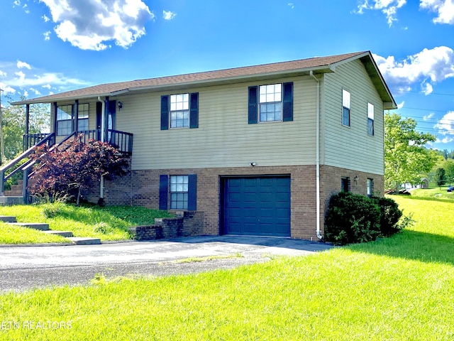 view of front facade with a front lawn and a garage