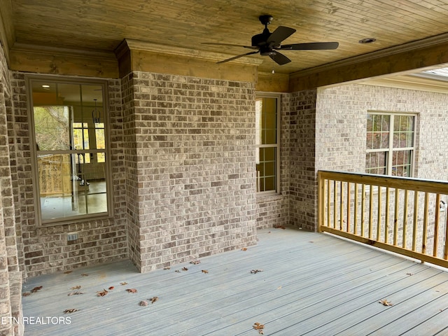 wooden deck featuring ceiling fan