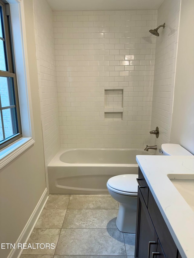 full bathroom with vanity, tiled shower / bath, and toilet