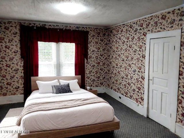 bedroom featuring dark carpet