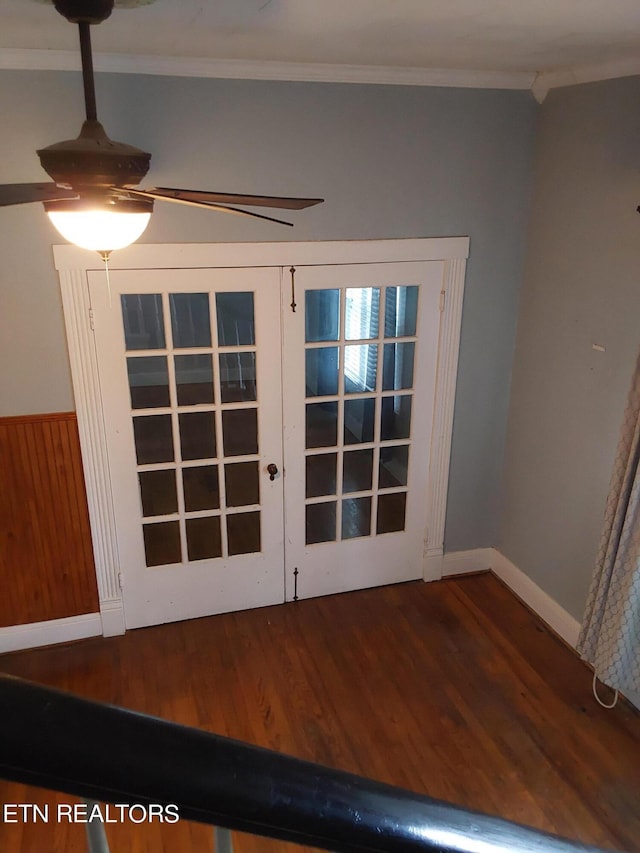 interior details featuring wood-type flooring, ornamental molding, and french doors