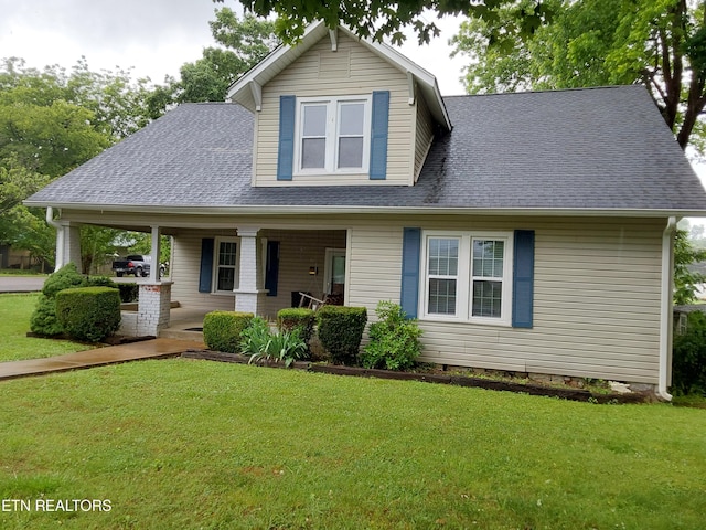 view of front facade featuring a front lawn and a porch