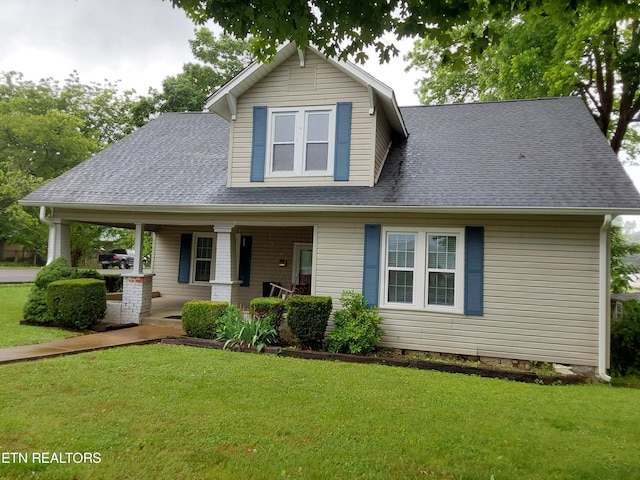 view of front of property with a porch and a front yard