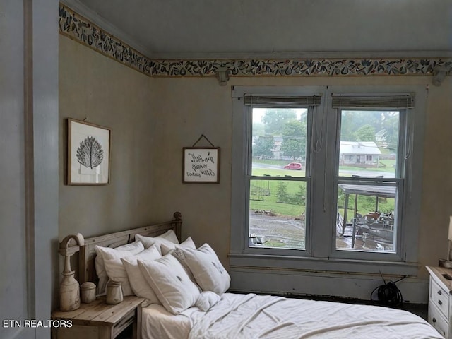 bedroom with ornamental molding