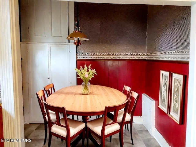 dining area with concrete flooring