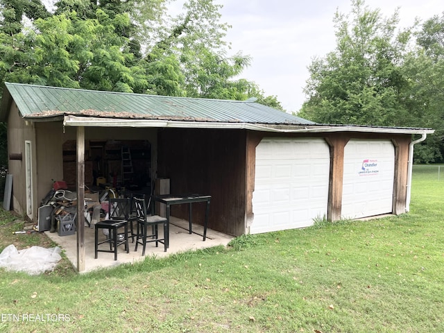 garage featuring a yard