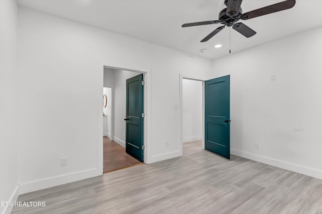 unfurnished bedroom featuring ceiling fan and light hardwood / wood-style floors