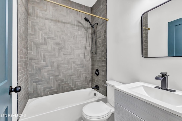 full bathroom with toilet, vanity, and tiled shower / bath combo