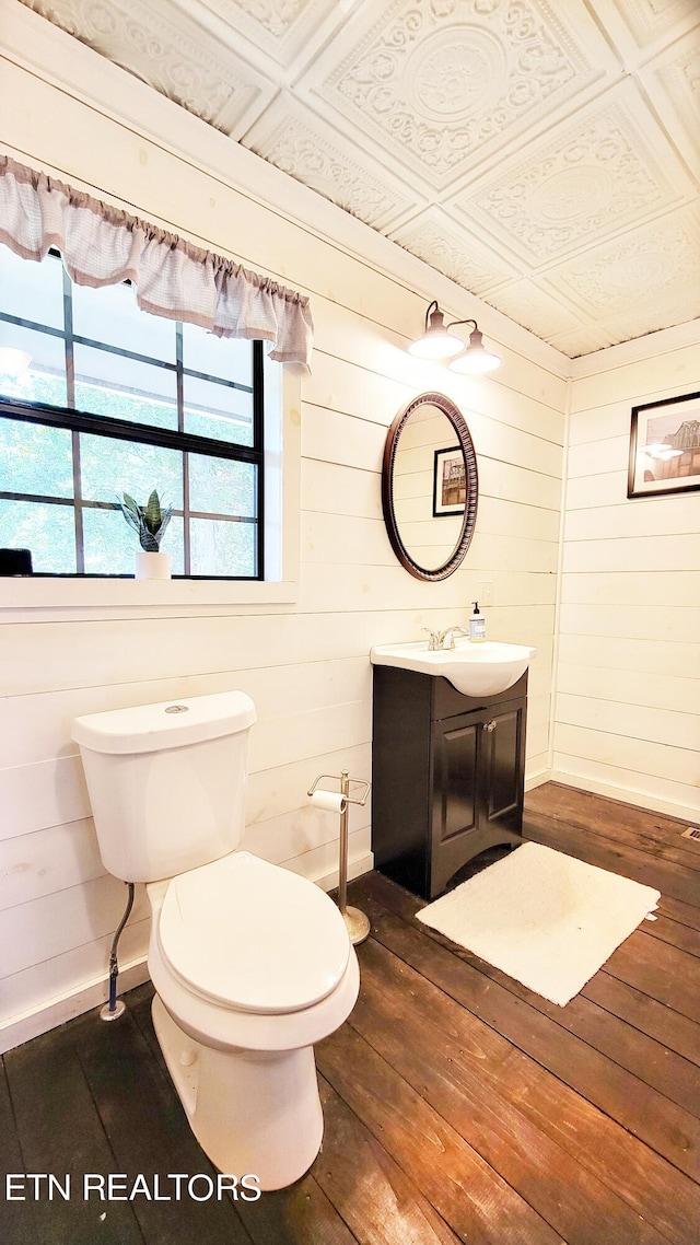 2109 Key Way, Sevierville, TN 37876 - half bathroom featuring hardwood / wood-style flooring, vanity, wooden walls, and an ornate ceiling