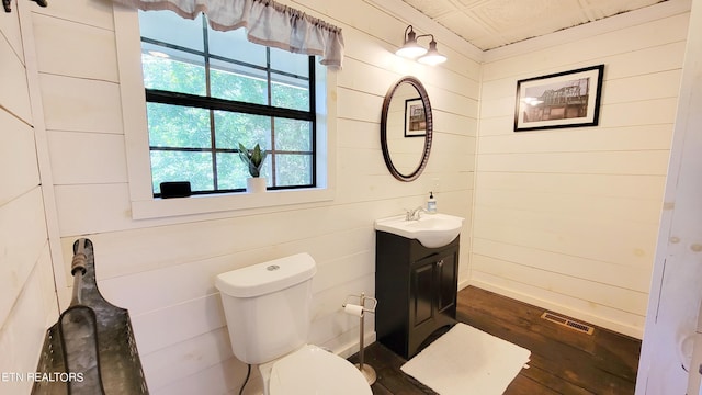 2109 Key Way, Sevierville, TN 37876 - bathroom featuring vanity, wood finished floors, plenty of natural light, and wooden walls