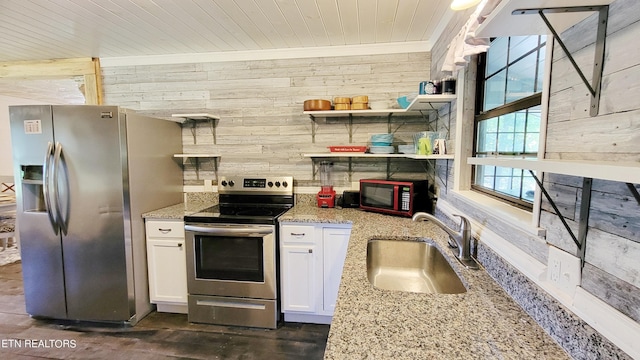 2109 Key Way, Sevierville, TN 37876 - kitchen featuring stainless steel appliances, wooden walls, white cabinetry, light stone countertops, and wooden ceiling
