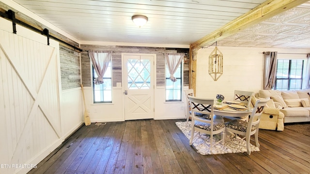 2109 Key Way, Sevierville, TN 37876 - foyer with a barn door, dark wood-style flooring, healthy amount of natural light, and wood walls