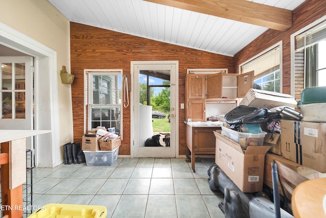 sunroom with vaulted ceiling with beams