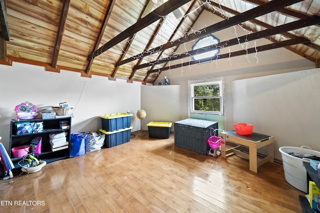 rec room featuring beamed ceiling, wood-type flooring, high vaulted ceiling, and wood ceiling