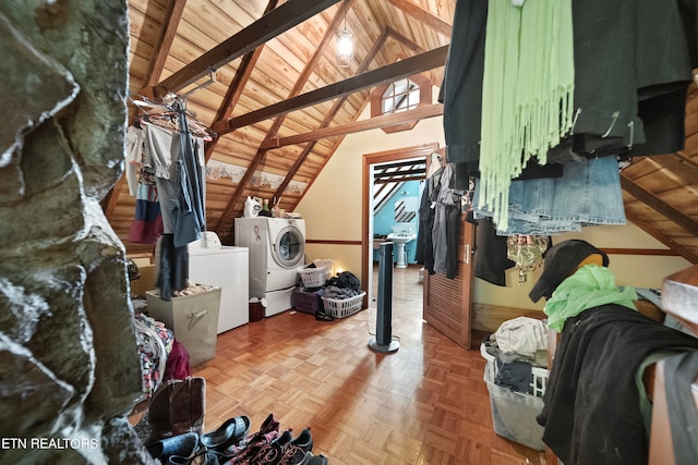 unfinished attic featuring washing machine and clothes dryer