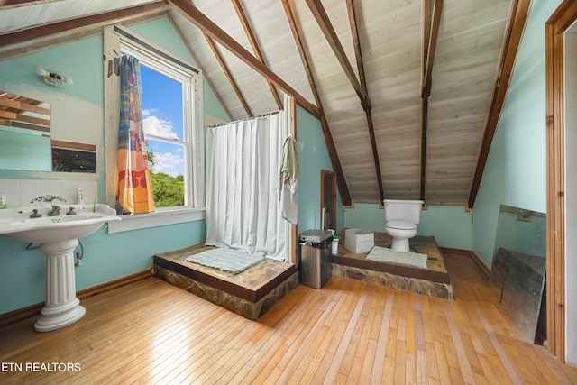 bathroom with vaulted ceiling with beams, toilet, wood ceiling, and hardwood / wood-style flooring