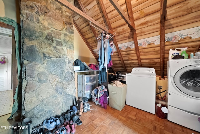 washroom featuring washer and clothes dryer, wooden ceiling, and parquet flooring