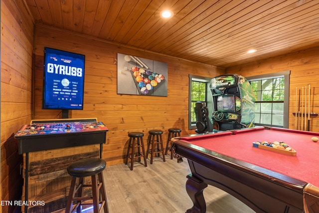 game room featuring wood-type flooring, pool table, wood walls, and wooden ceiling