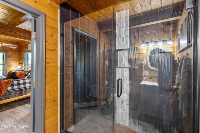 bathroom with wood ceiling, wood walls, ceiling fan, walk in shower, and beamed ceiling