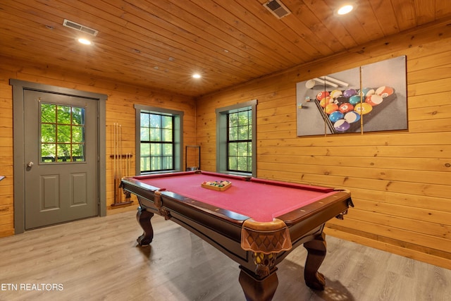 rec room with light hardwood / wood-style floors, wooden ceiling, pool table, and wooden walls