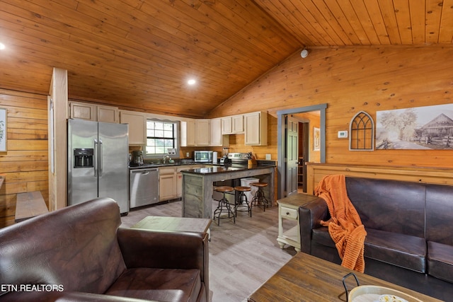 kitchen featuring lofted ceiling, wood walls, light hardwood / wood-style floors, wood ceiling, and stainless steel appliances